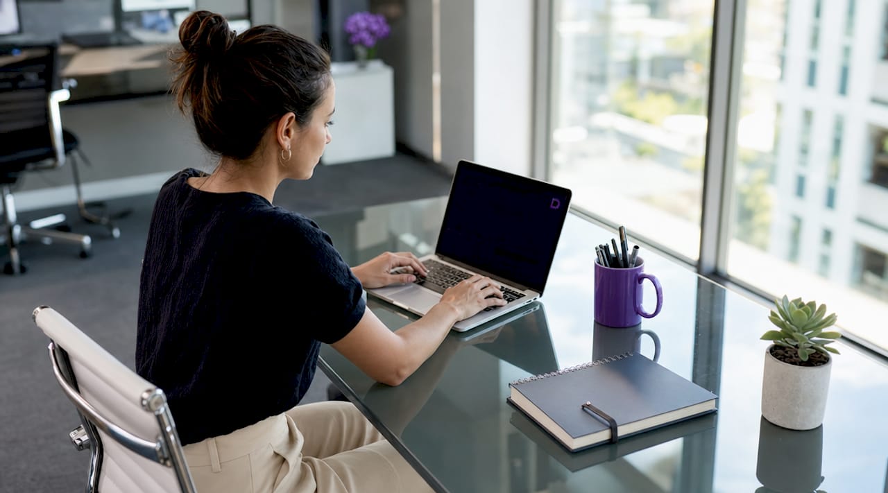 Australian woman registering domain on laptop