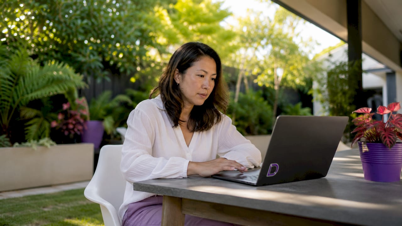 Woman setting up private domain registration at home